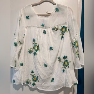 📦 Fig and Flower White Blouse with Blue and Yellow Embroidery